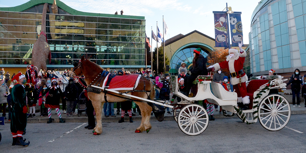 Santa in Horse and Carriage in front of The Children's Museum